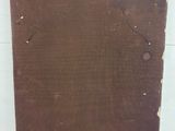 an old brown piece of paper with a label on it