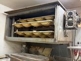 a picture of a commercial kitchen with a lot of food in it