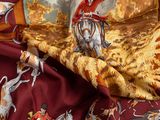 une image représentant un foulard en soie orné d'un cheval et d'un cavalier