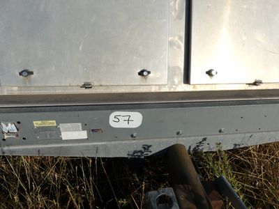 a close up of a metal trailer with a number on it