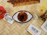 a plate with a tortoise on it next to some hair combs