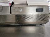 a stack of books sitting on top of a metal table
