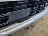 a close up of the front bumper of a car