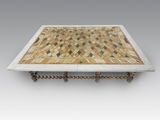 an image of a marble coffee table with wooden legs and a tile top