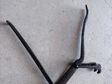 a small black object on the floor that looks like a twig