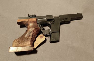 a gun with a tag on it laying on the floor
