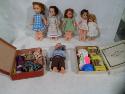 a lot of dolls that are sitting in a box