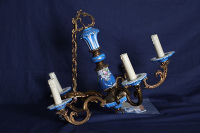a chandelier with a blue and white design on it