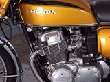 a yellow motorcycle that is parked in a garage
