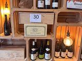 many bottles of wine on the shelves in the wine cellar