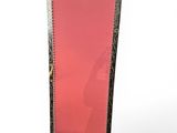 an ornately decorated mirror stands on a white surface