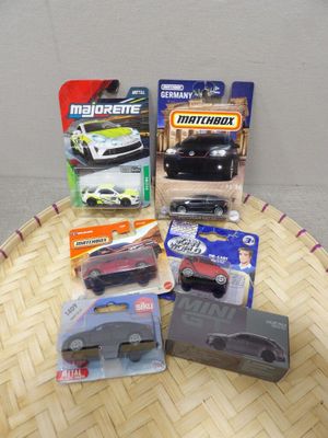 a lot of different toy cars on a table