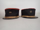 two hats with numbers on them sitting on top of a table
