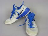 pair of white and blue sneakers with blue laces on them