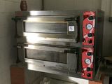 an image of a commercial pizza oven in a kitchen