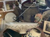 many different vases on the table in the store