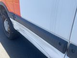 an image of a van that has been painted orange and white