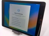 a tablet that has a sign on the screen