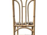 the chair is made of bamboo and has a seat made of rattans
