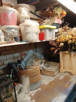 many vases and containers on the shelves in this room