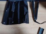 a black bag sitting on top of a table next to a pair of scissors and a pair of scissors