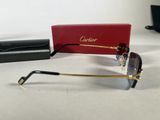 a pair of glasses sitting on a table next to a red box