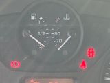 a car dashboard with a speedometer and a clock on it