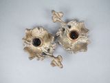 pair of gold plated candlesticks with garnets and leaves