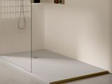 a walk in shower with a glass door in a bathroom