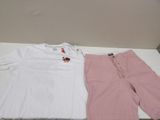 a white shirt and pink pants sitting on a table