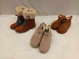 three pairs of women ' s shoes are lined up on a bed