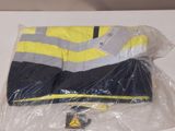 a yellow and black jacket on a plastic bag