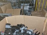a cardboard box filled with assorted electronic equipment