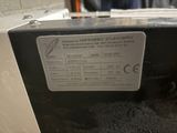 a close up of a microwave with a label on it