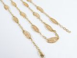 a set of three gold chain necklaces