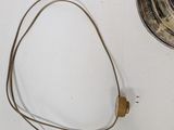 a lamp that is sitting on a table next to a cord