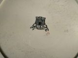 a white plate with a castle on it on a table