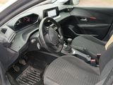 the interior of a car with a steering wheel and dashboard controls
