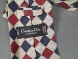a close up of a tie with a tag on it