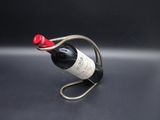 a wine bottle holder that has a wine bottle in it