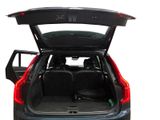the back end of a car with the trunk open and the seats down