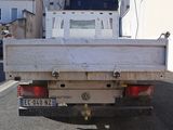 a white truck parked on the side of the road