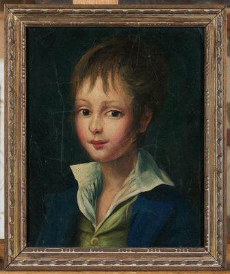 portrait of a young boy in a blue jacket and white collared shirt