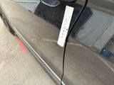 a sticker on the side of a car with a name tag attached to it
