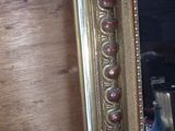 a mirror that is on the wall in the room