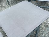two chairs that are sitting next to each other on the gravel