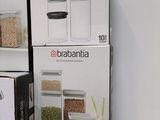 three boxes of food are stacked on top of each other on a counter