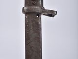 a close up of a knife on a white surface