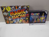 a box of magic show and a box of magnets on a table