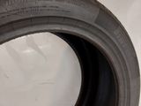 a close up of a tire tire on a white surface